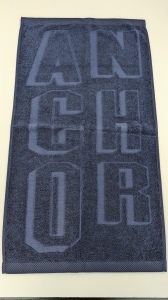 Serviette jacquard logo embossé relief éponge uni 3