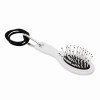 Brosse de voyage avec élastiques à cheveux COIFFEUR